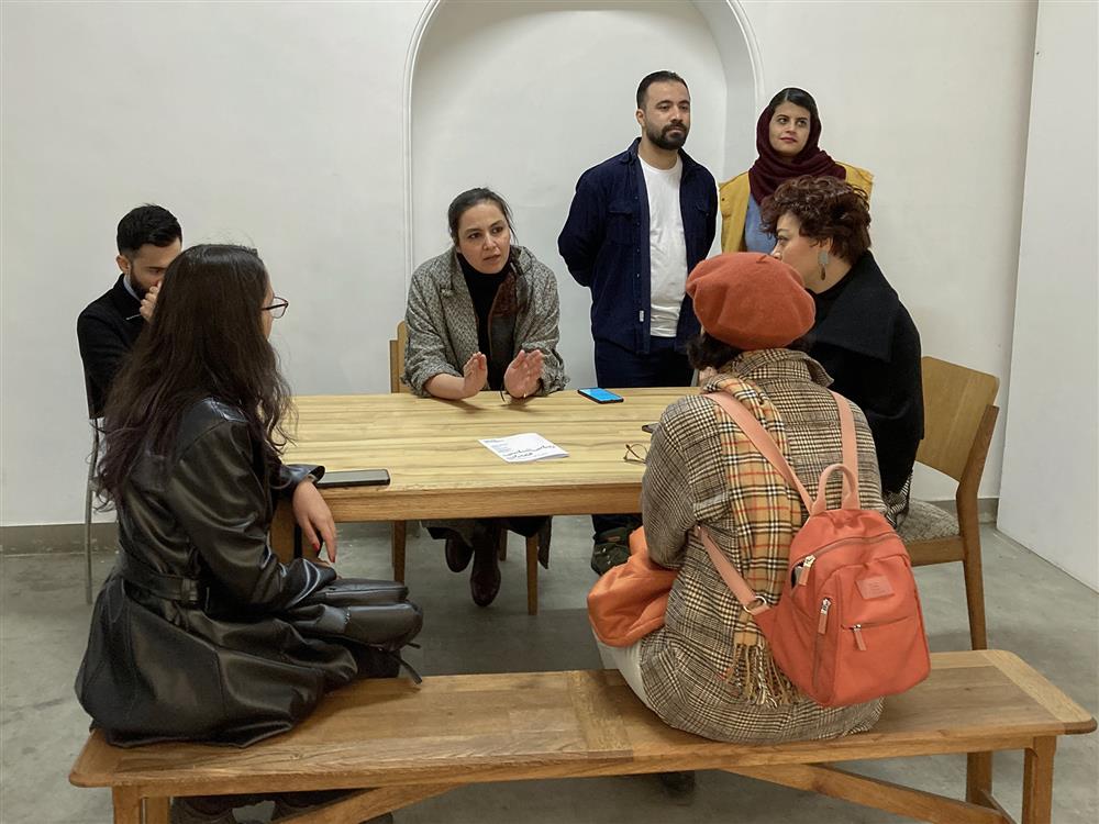 the exhibition curators conversing with viewers